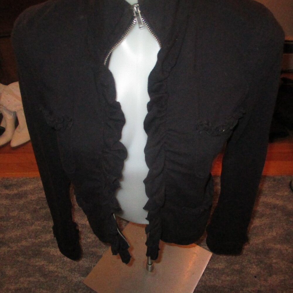 inc jacket/sweatshirt material but fancy with ruffle  unique small